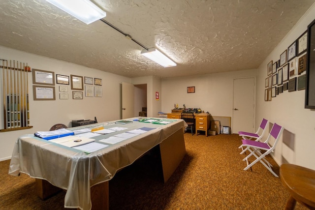 playroom featuring billiards, dark carpet, and a textured ceiling