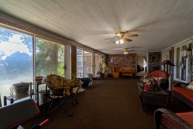 sunroom / solarium with ceiling fan