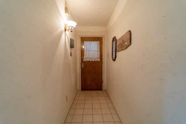 hall with light tile patterned flooring