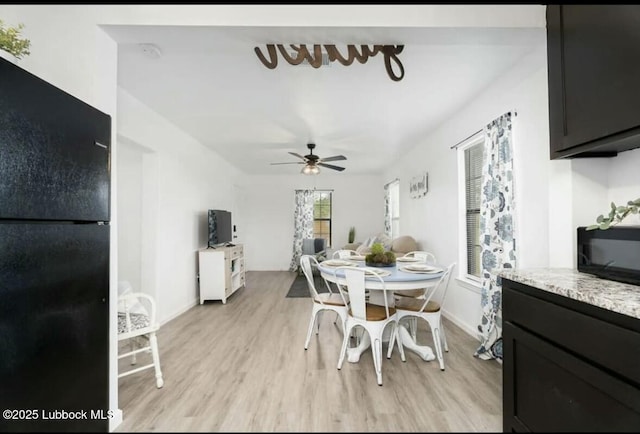 1502 30th St, Lubbock, TX 79411 - dining space featuring light wood-style flooring and a ceiling fan