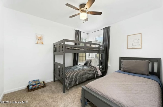 1502 30th St, Lubbock, TX 79411 - carpeted bedroom featuring baseboards and a ceiling fan