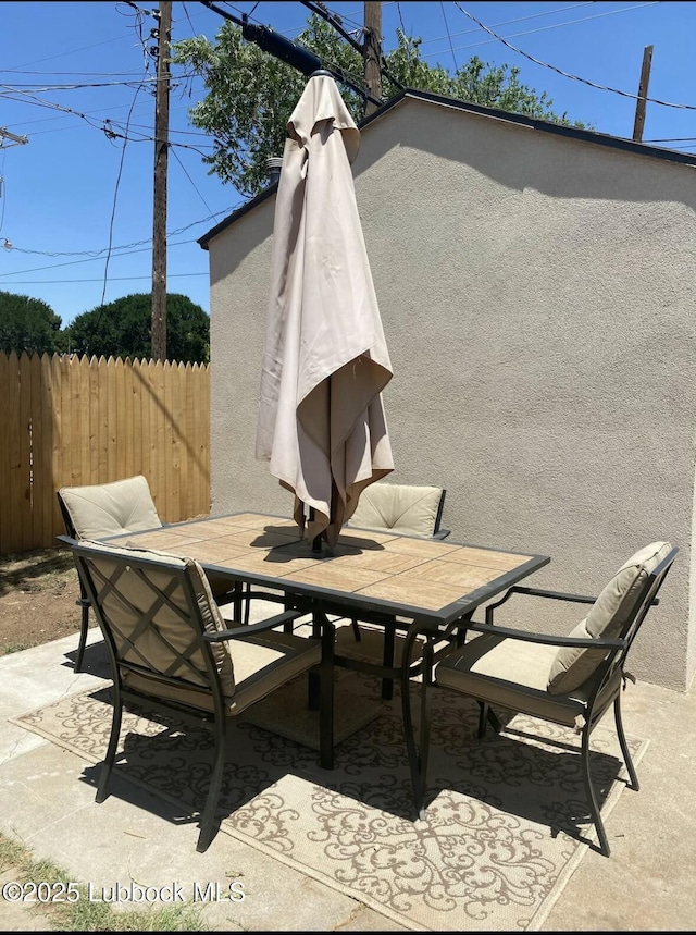 1502 30th St, Lubbock, TX 79411 - view of patio featuring outdoor dining area