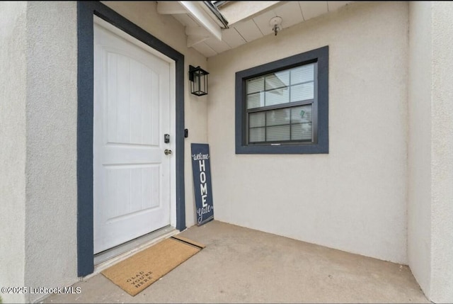 1502 30th St, Lubbock, TX 79411 - doorway to property featuring stucco siding
