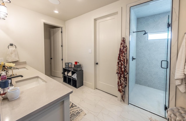 bathroom featuring an enclosed shower and vanity