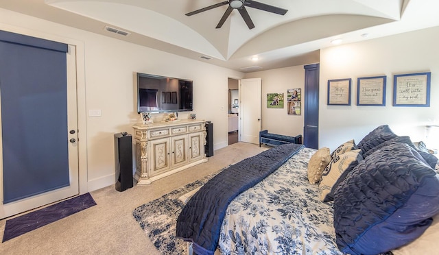 carpeted bedroom with lofted ceiling and ceiling fan