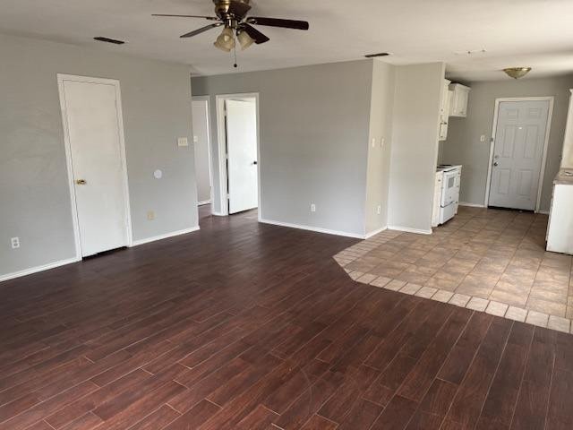 unfurnished living room with ceiling fan