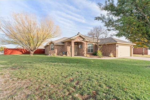 single story home with a garage and a front lawn