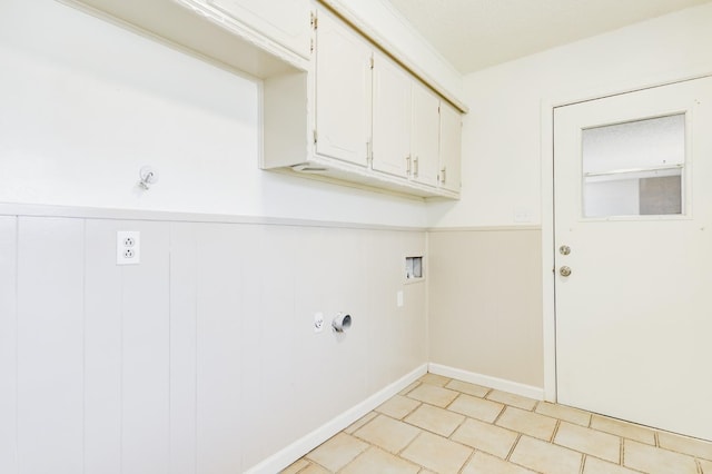 laundry room featuring cabinets, light tile patterned flooring, and washer hookup