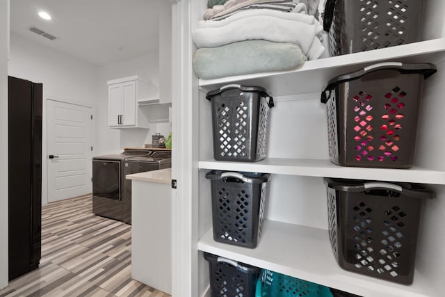 pantry with washing machine and clothes dryer