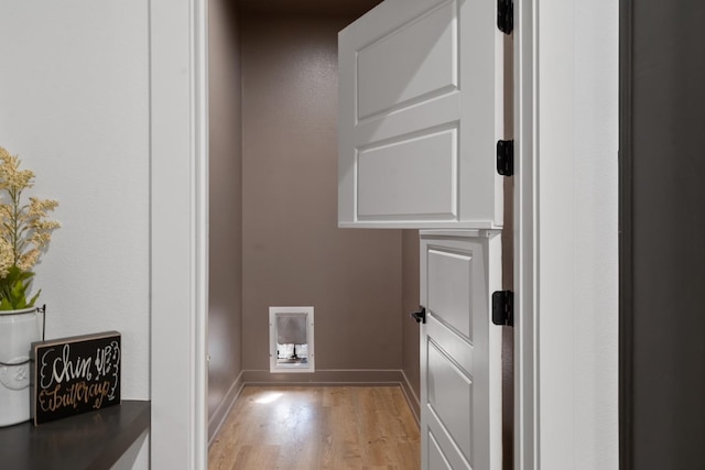 washroom with light wood-type flooring