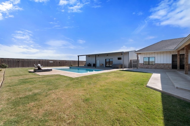 exterior space with a fenced in pool, a yard, and a patio