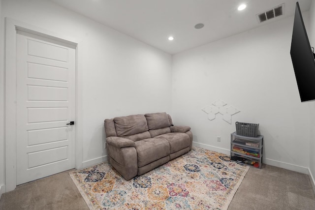 sitting room with light colored carpet