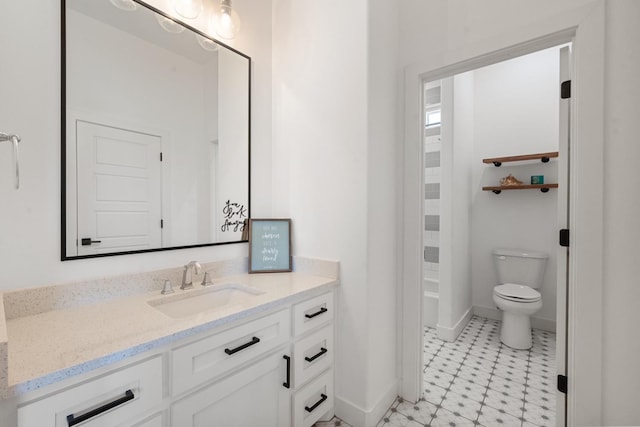 bathroom with vanity and toilet