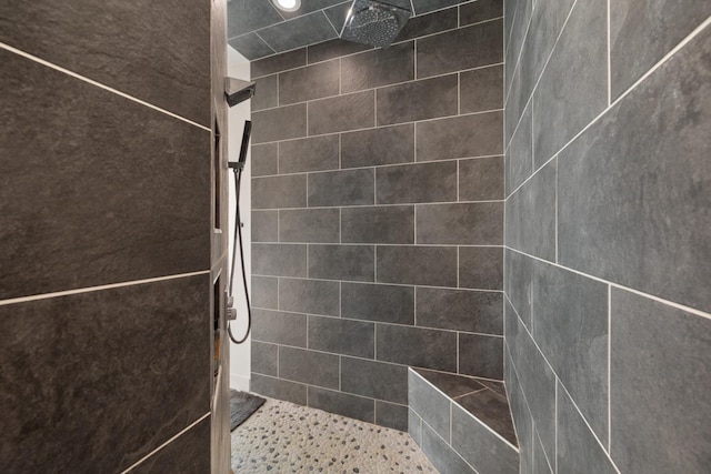 bathroom with tiled shower