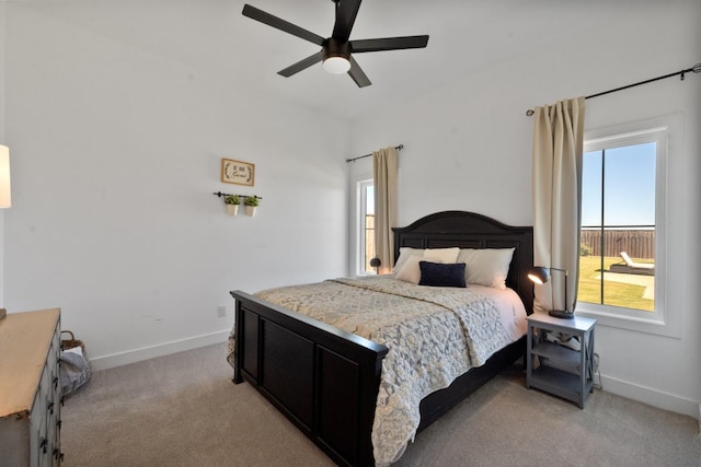 bedroom featuring light carpet and ceiling fan