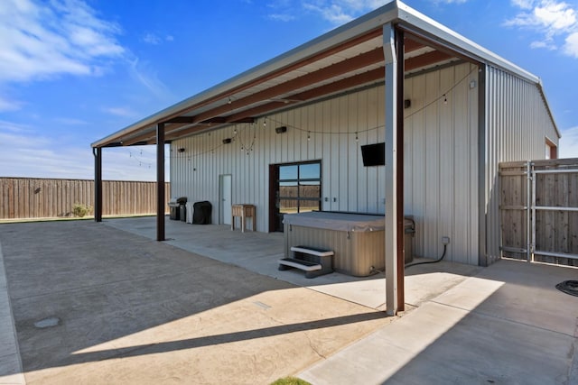 view of patio / terrace featuring a hot tub