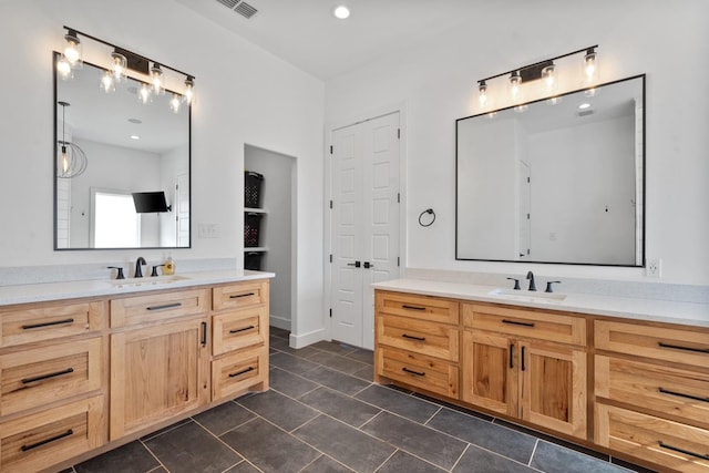 bathroom with vanity and tile patterned floors