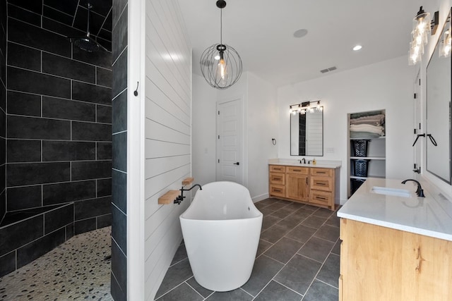 bathroom with vanity, shower with separate bathtub, and tile patterned floors