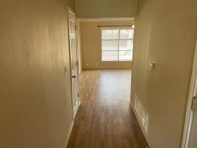 hallway featuring dark hardwood / wood-style flooring