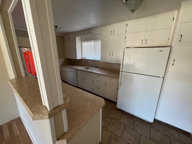 kitchen featuring white cabinetry, white appliances, crown molding, and sink