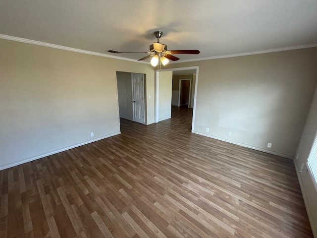 empty room with crown molding, ceiling fan, and hardwood / wood-style floors