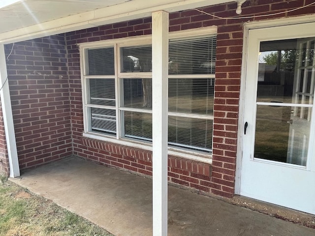 doorway to property with a patio