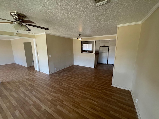 unfurnished room with dark hardwood / wood-style flooring, crown molding, a textured ceiling, and ceiling fan