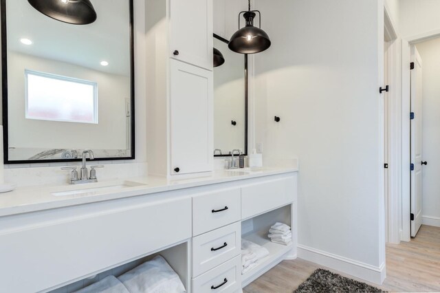 bathroom featuring vanity and hardwood / wood-style flooring