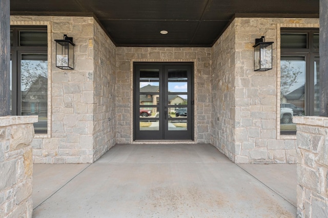 entrance to property featuring french doors