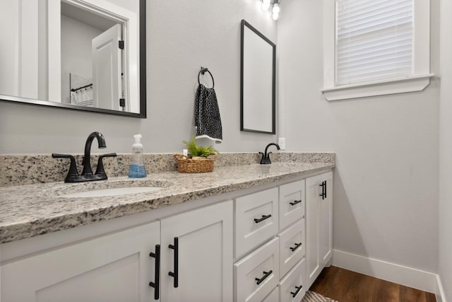 bathroom featuring vanity and hardwood / wood-style floors