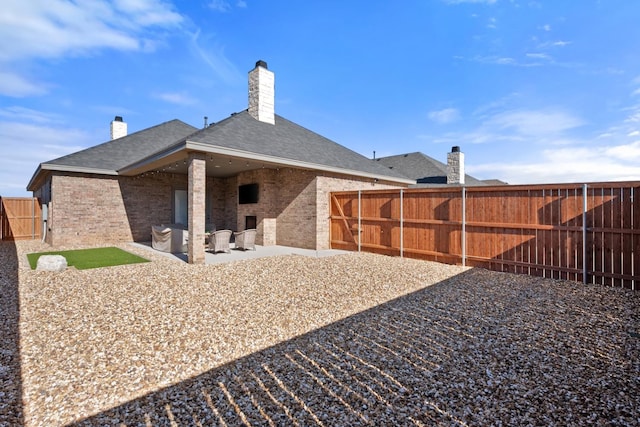 rear view of house featuring a patio