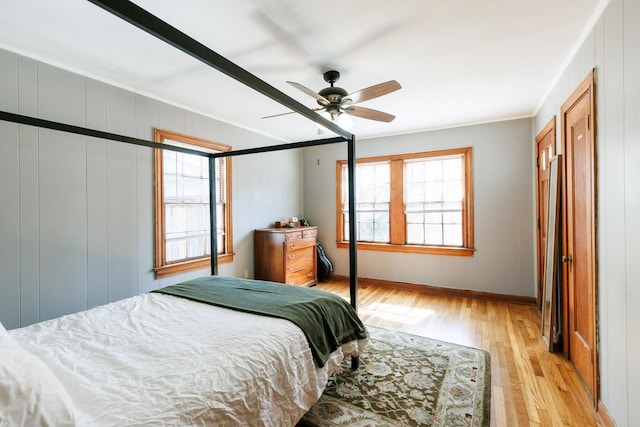 bedroom with ceiling fan and light wood-type flooring