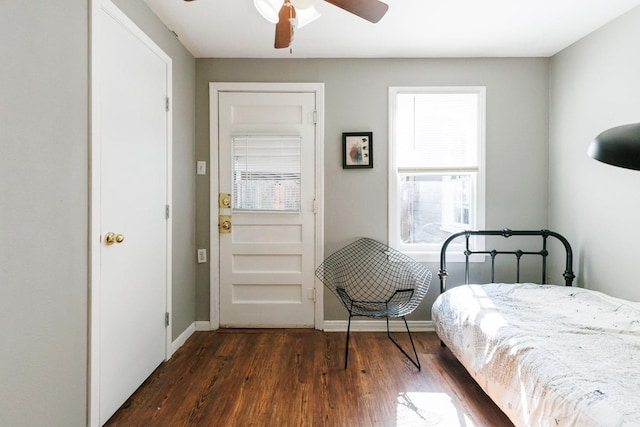 bedroom with dark wood-type flooring and ceiling fan