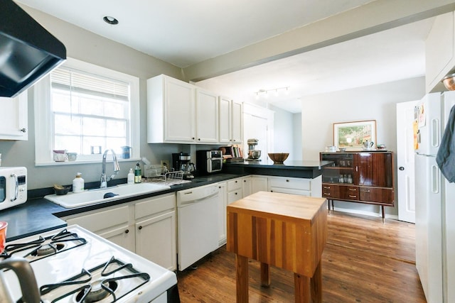 kitchen with dark wood-type flooring, sink, white cabinetry, ventilation hood, and white appliances