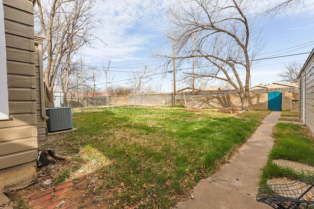 view of yard with central AC unit