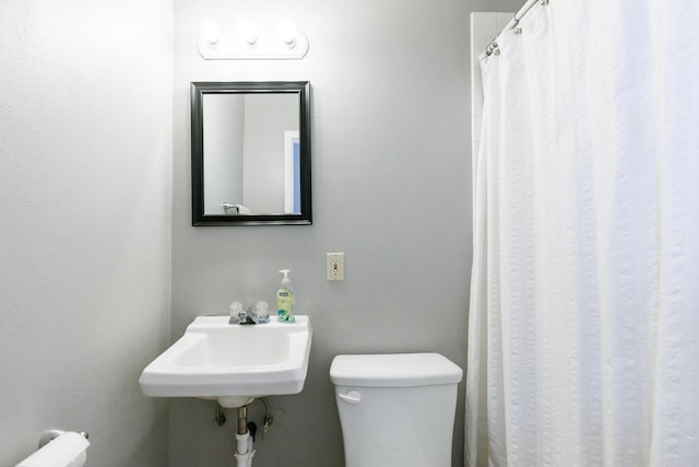 bathroom with toilet and sink