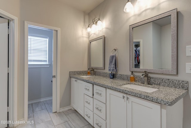 12010 N Crk 1500, Shallowater, TX 79363 - full bath with double vanity, marble finish flooring, and baseboards