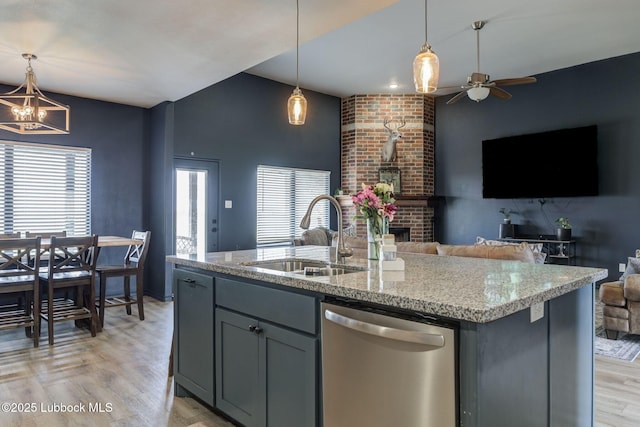12010 N Crk 1500, Shallowater, TX 79363 - kitchen featuring dishwasher, a sink, gray cabinetry, open floor plan, and light wood-type flooring