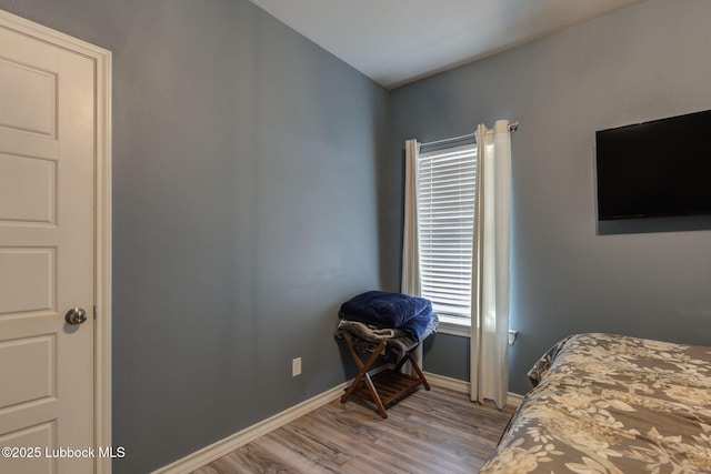 12010 N Crk 1500, Shallowater, TX 79363 - bedroom featuring light wood-style flooring and baseboards