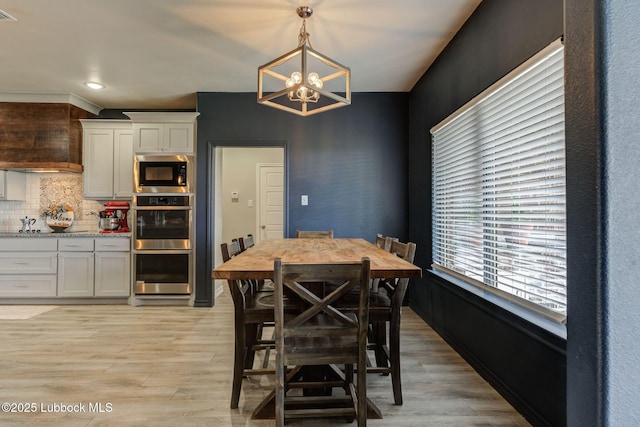 12010 N Crk 1500, Shallowater, TX 79363 - dining area featuring a chandelier, light wood-style floors, and recessed lighting