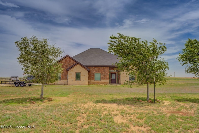 12010 N Crk 1500, Shallowater, TX 79363 - view of front of home featuring brick siding, a front yard, and a shingled roof