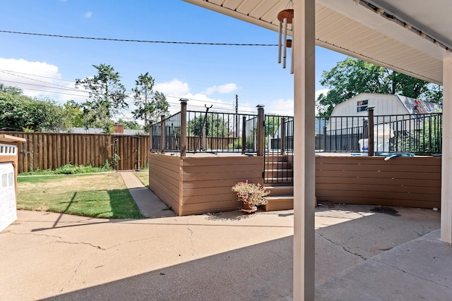 view of patio / terrace featuring a storage shed