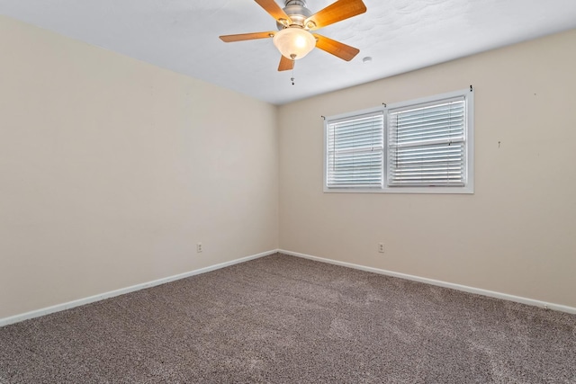 unfurnished room featuring ceiling fan and carpet flooring