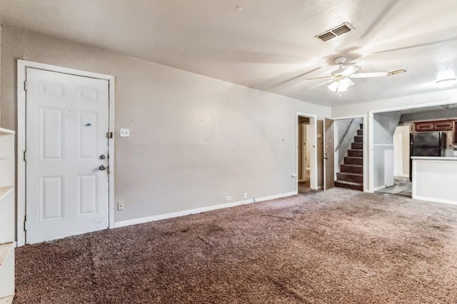 unfurnished living room with carpet floors and ceiling fan