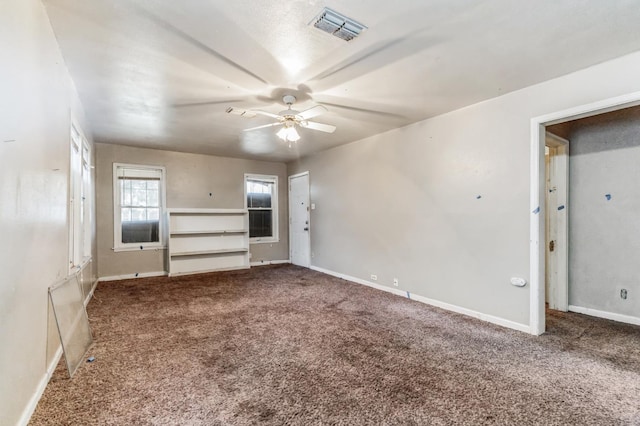 interior space with ceiling fan and carpet