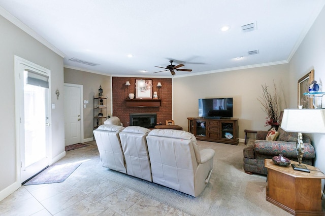 living room with a brick fireplace, ornamental molding, and ceiling fan