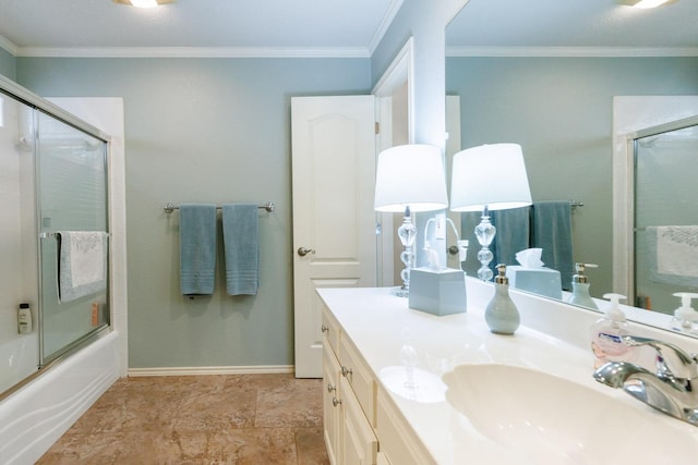 bathroom with vanity, ornamental molding, and shower / bath combination with glass door