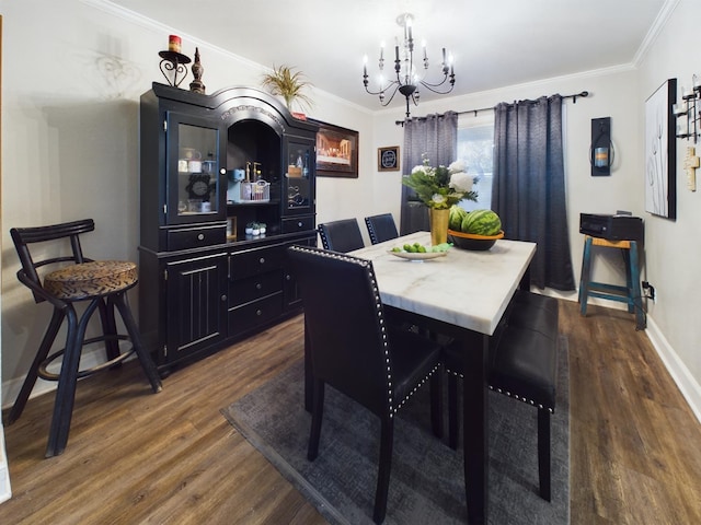 dining room featuring ornamental molding, dark wood-type flooring, and a chandelier