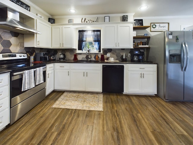 kitchen with wall chimney exhaust hood, white cabinetry, stainless steel appliances, and sink