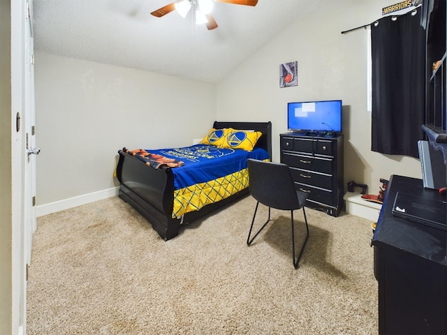 carpeted bedroom featuring lofted ceiling and ceiling fan